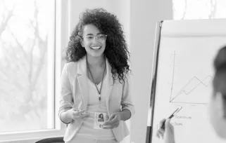woman wearing lanyard in office smiling