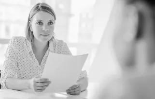 woman reading a resume in an interview