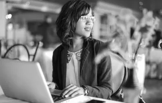 Advertising%20account%20executive At%20desk With%20laptop%20copyB%26W Png