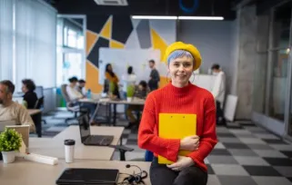 Young woman working in the office of a start-up company.