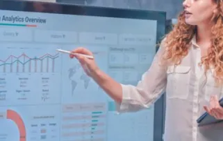 Woman is looking at statistics to see if she reached her goals.