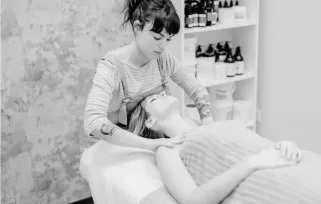 esthetician giving a client a skin treatment