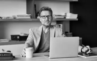 Man In%20glasses Sitting%20at%20desk At%20laptopB%26W Png