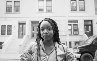 woman standing outside building