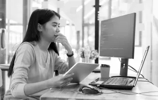 Software Tester At%20computer With%20tablet%20copyB%26W Png