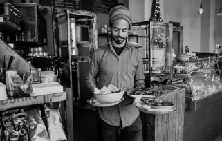 waiter carrying food plates