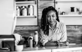 woman behind restaurant counter