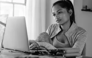 woman typing on a laptop