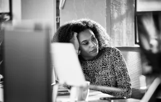 woman sitting at computer looking frustrated