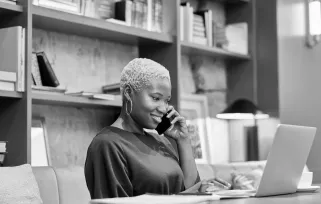 Woman Talking%20on%20phone Working%20on%20laptopB%26W Png