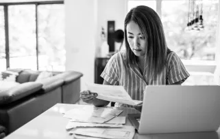 Woman Working%20at%20home Sitting%20at%20kitchen With%20laptop Holding%20paperB%26W Png