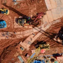 view of excavator heavy machine and mobile crane tower crane with worker in new construction site